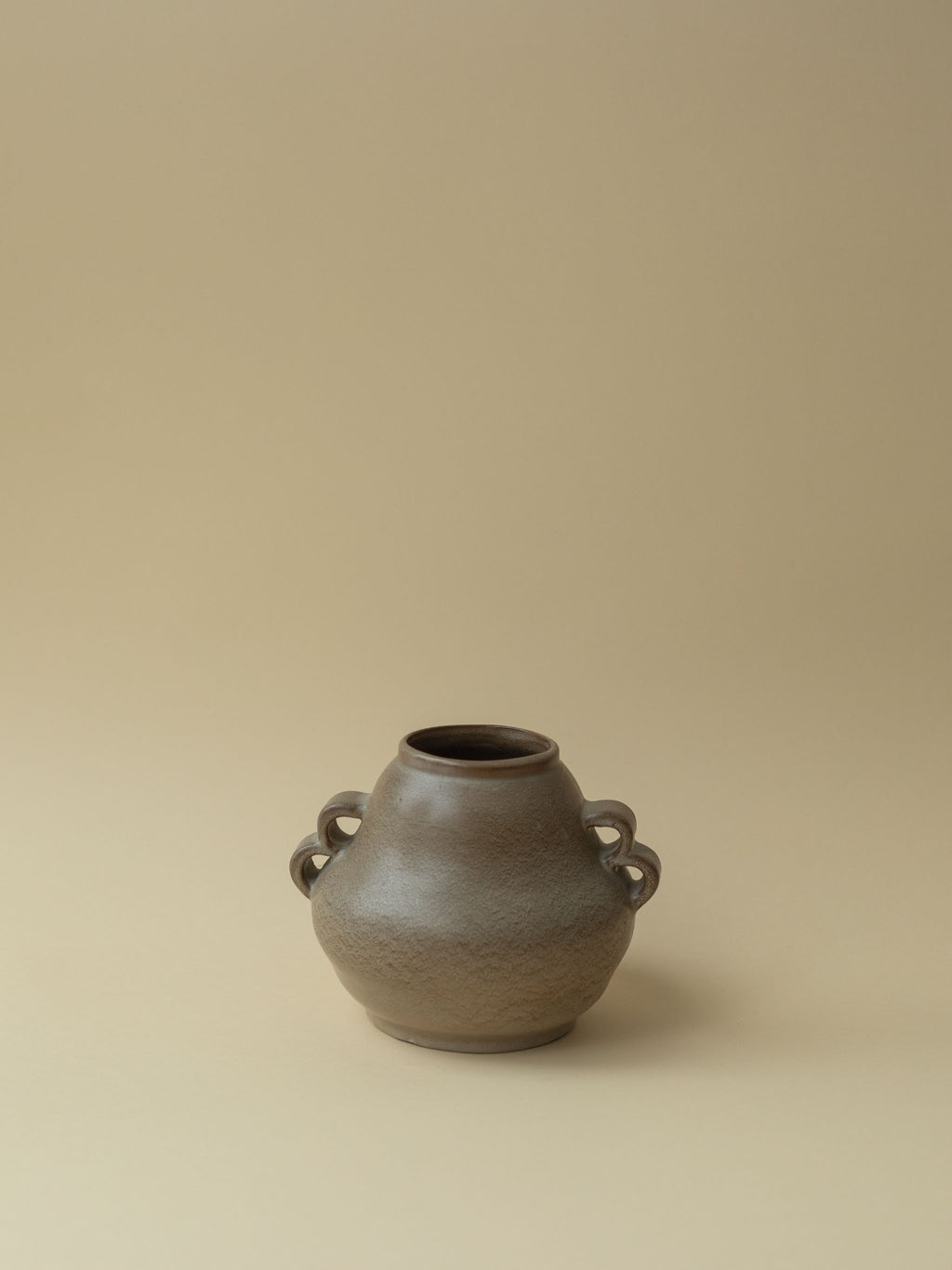 A brown vintage ceramic vase by Kupittaan Savi. Scandinavian design from Finland.