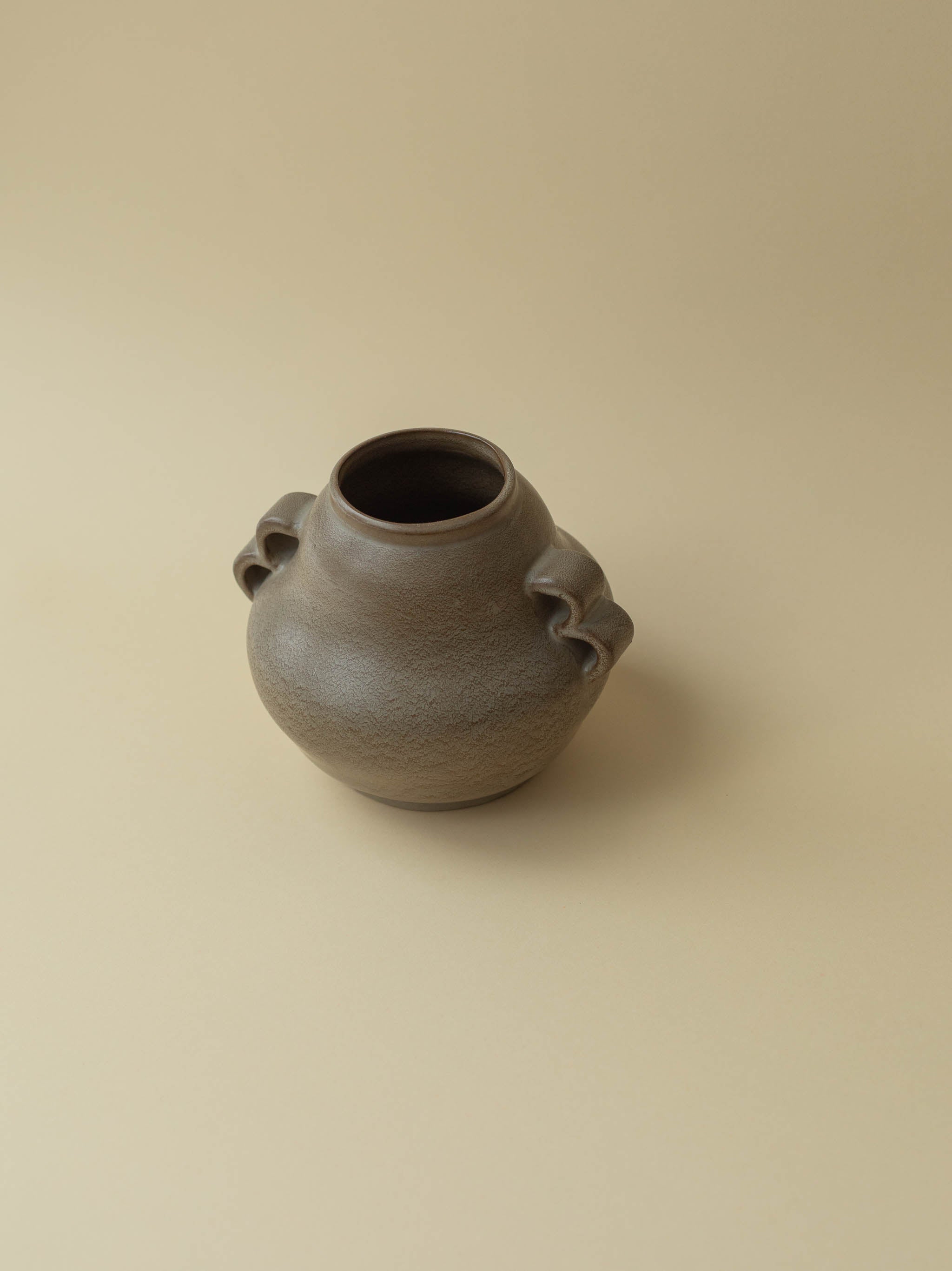 A brown vintage ceramic vase by Kupittaan Savi. Scandinavian design from Finland.