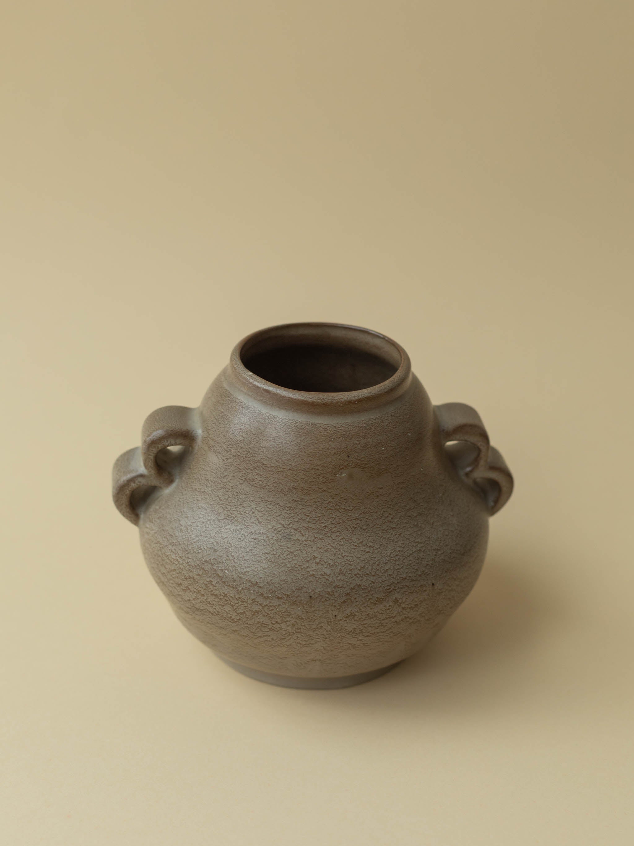 A brown vintage ceramic vase by Kupittaan Savi. Scandinavian design from Finland.