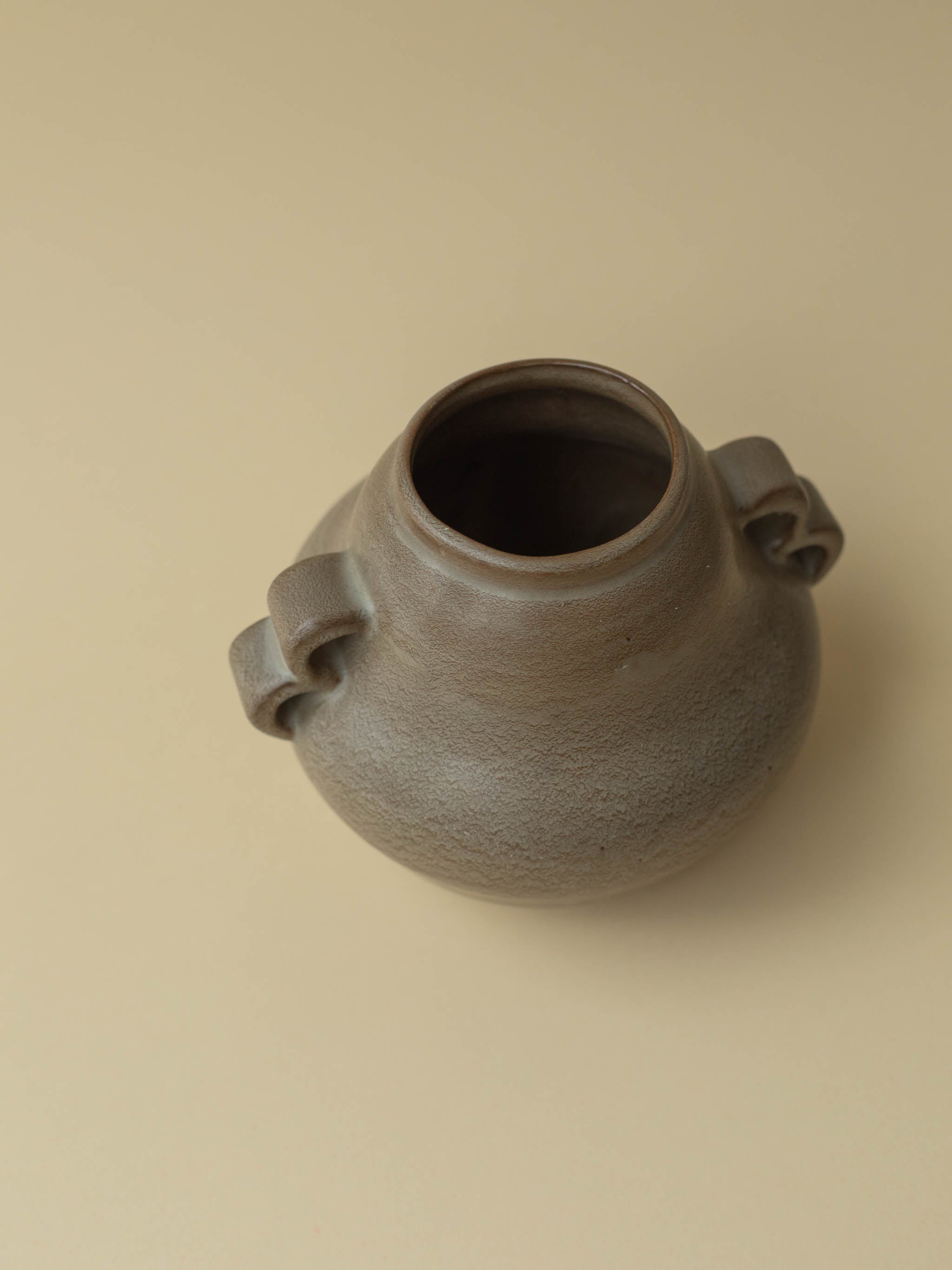 A brown vintage ceramic vase by Kupittaan Savi. Scandinavian design from Finland.
